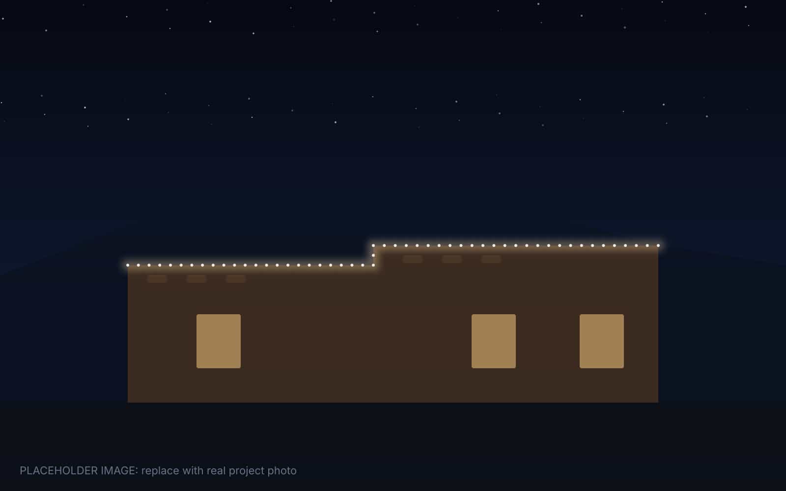 Adobe home in Corrales with warm permanent lights along the parapet