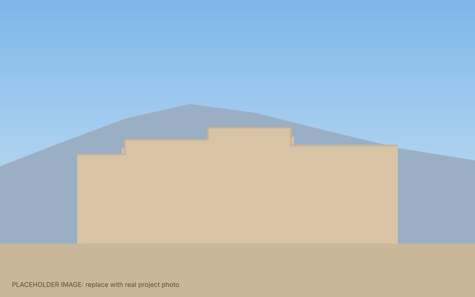 Albuquerque stucco home during the day with the permanent light track hidden along its parapet