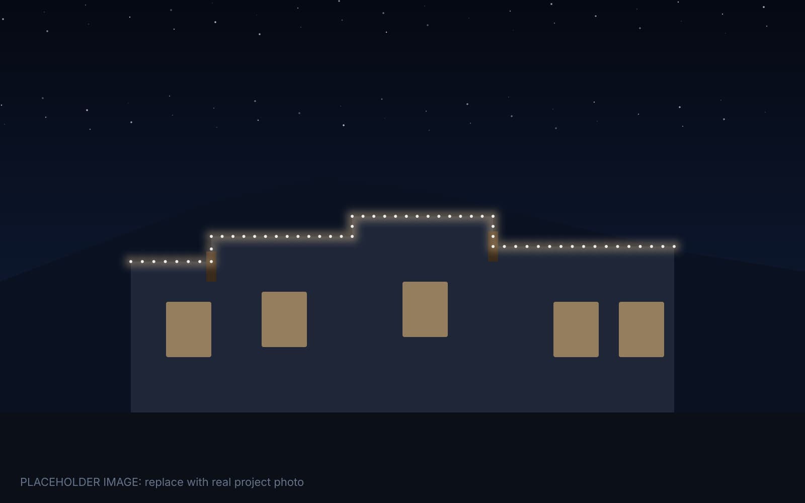 Pueblo Revival home in Albuquerque with permanent lights tracing the stucco parapet at night